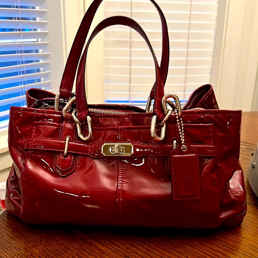Coach purse. Leather. Dark red. Good condition. One small scratch on the back.